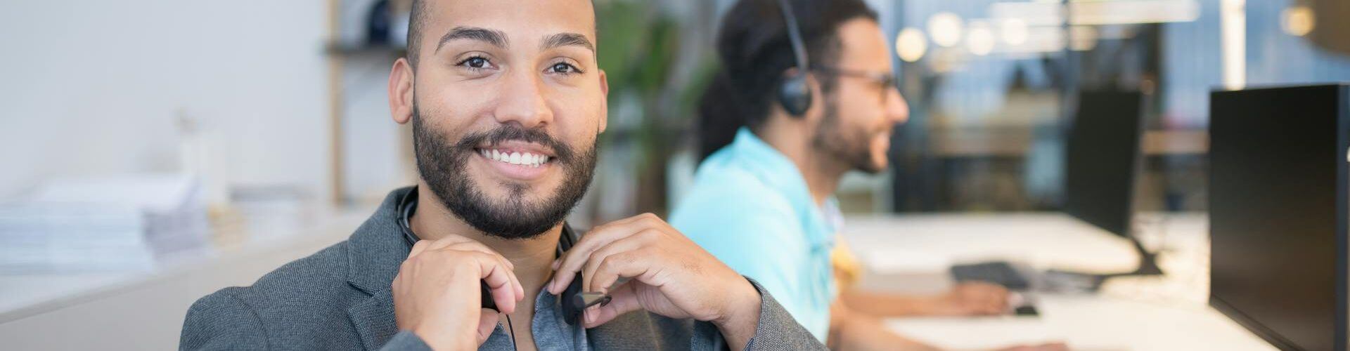 Contact Us. Image of friendly staff waiting for your call.