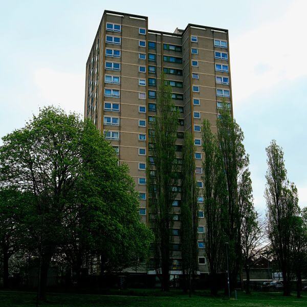 A high-rise residential block of flats in England, requiring a designated fire safety responsible person to implement updated 2026 evacuation regulations.